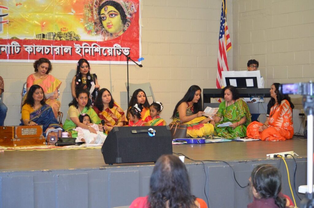 Singers on stage under the CCI banner